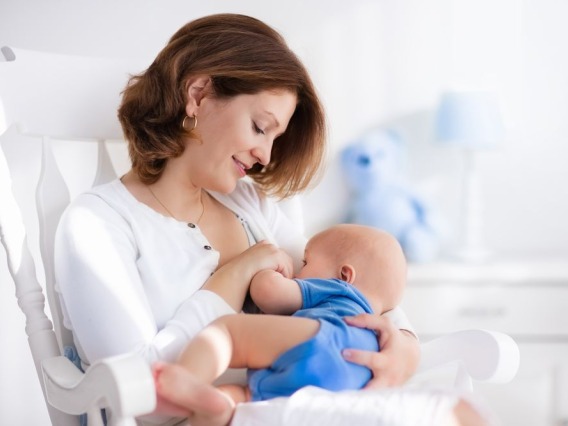 Working Mother Breastfeeding Baby